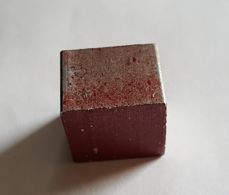 Photo of small aluminum block.